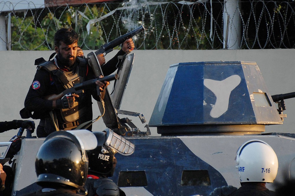 Police fire teargas shells toward activists and supporters of former Pakistan Prime Minister Imran during a protest against the arrest of the ex-leader. Photo: AFP