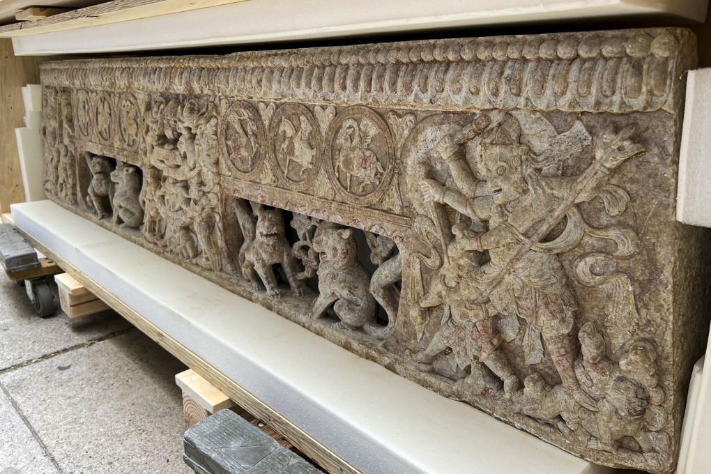 Two stone carvings were presented to the Chinese consulate in New York, after an investigation found they were stolen from a tomb in the 1990s and smuggled out of China. Photo: Twitter/@CGHuangPingNY