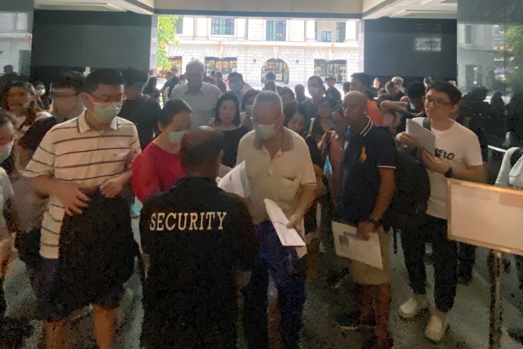 Many were forced to wait in the heat outside Singapore’s China Visa Application Centre. Photo: Kimberly Lim