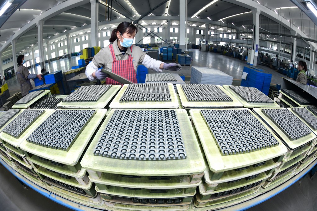 A worker produces magnetic materials for the photovoltaic and other fields at Guanyouda Magnetic Industry Co. in east China’s Jiangsu province. China saw mixed trade figures for April as the global economy struggles to rebound. Photo: Getty Images