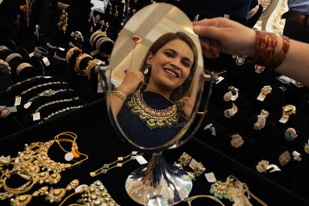 A woman tries on a necklace at a fashion and lifestyle event in Amritsar, India on May 6. India under Narendra Modi has prospered, and the economy is booming. Photo: AFP