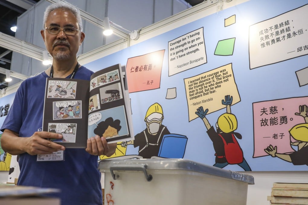 Cartoonist Zunzi, real name Wong Kei-kwan, with one of his books. Photo: Nora Tam