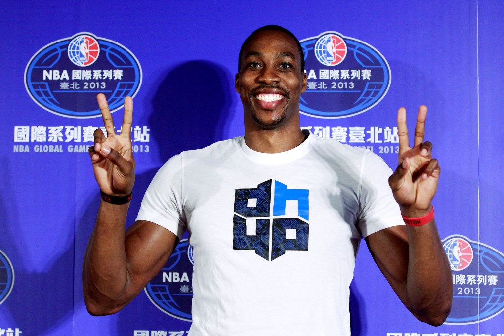 Dwight Howard, then a Houston Rockets player in the NBA, poses for pictures during a news conference in Taipei on October 11, 2013. Photo: Reuters