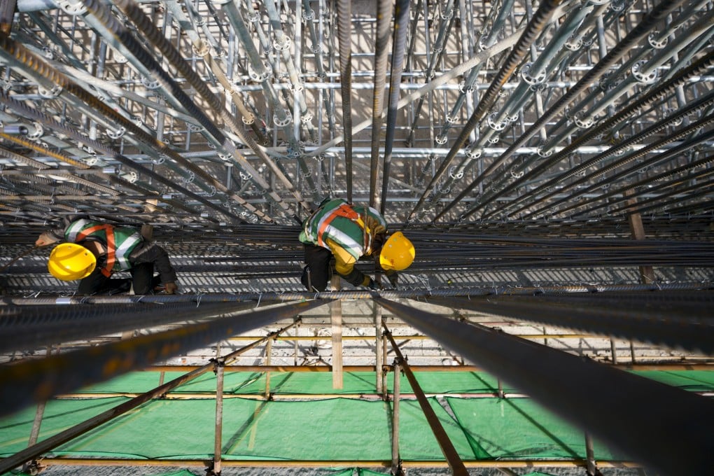 Workers are seen on a construction site for municipal support facilities at the Rongdong area of Xiongan New Area, in Hebei province, on March 30, 2021. Photo: Xinhua