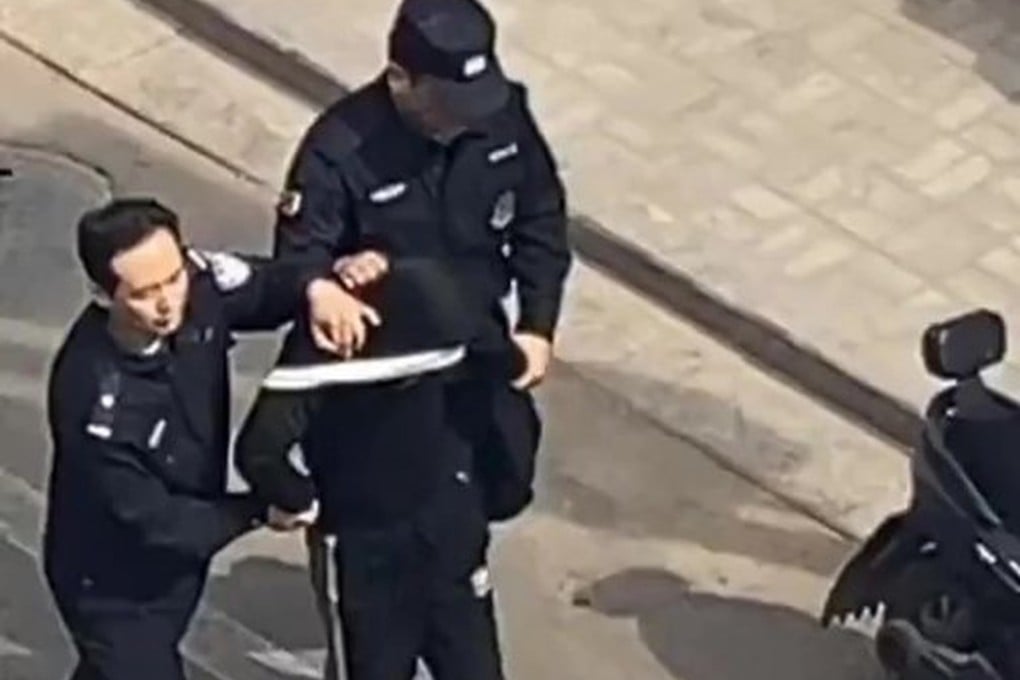 Police in Xing county, Shanxi, detain a man accused of killing seven in a home and car attack. Photo: Weibo