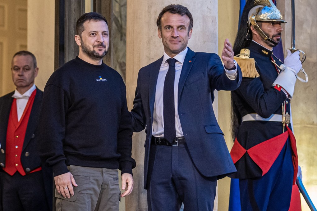 French President Emmanuel Macron, right, welcomes his Ukrainian counterpart  Volodymyr Zelensky at the Elysee Palace in Paris, France on Sunday. Photo: EPA-EFE