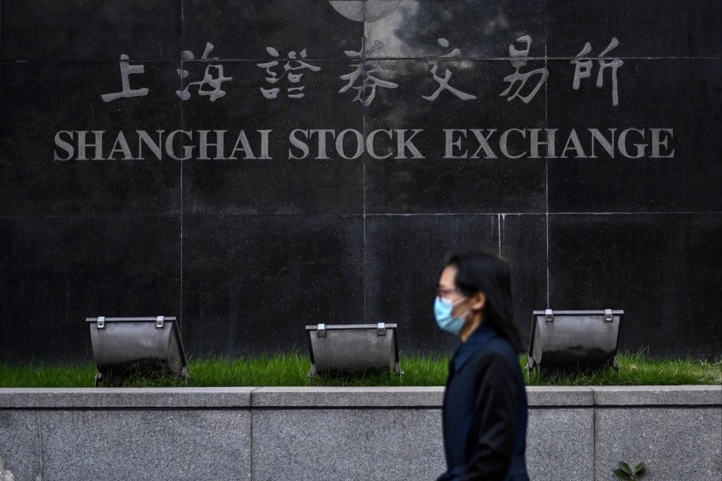 A pedestrian walks past the Shanghai Stock Exchange in Shanghai. Photo: AFP