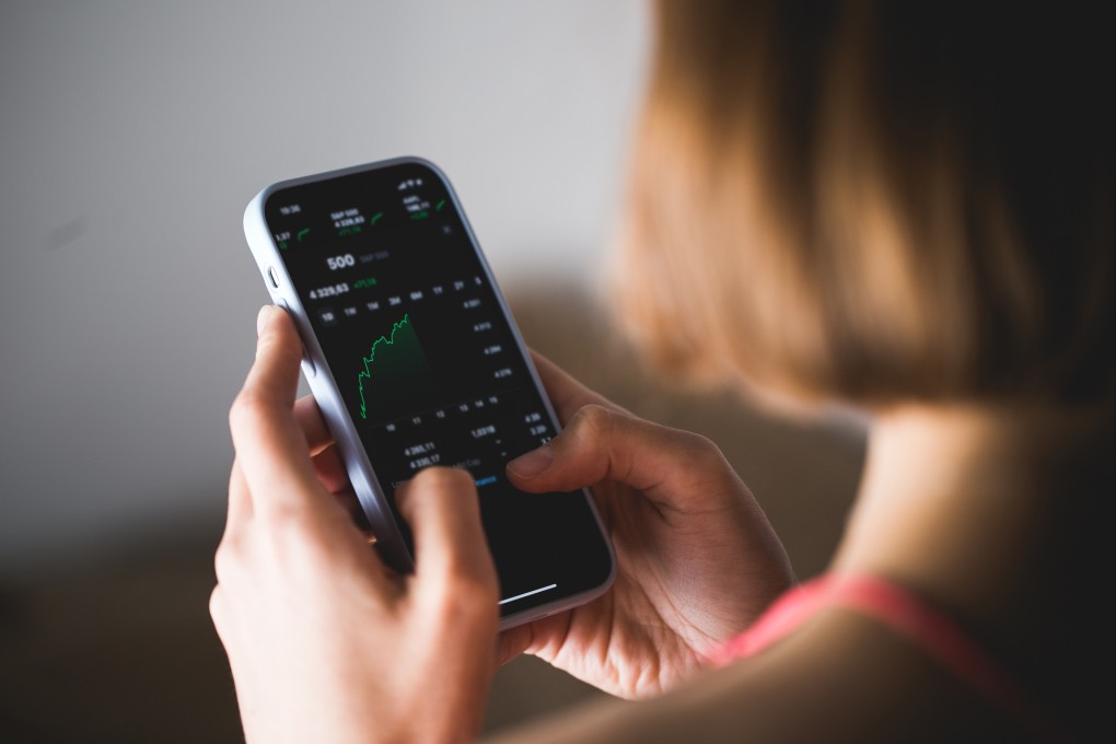 Futu and UP Fintech trading apps will be removed from China app stores this week. Photo: Shutterstock