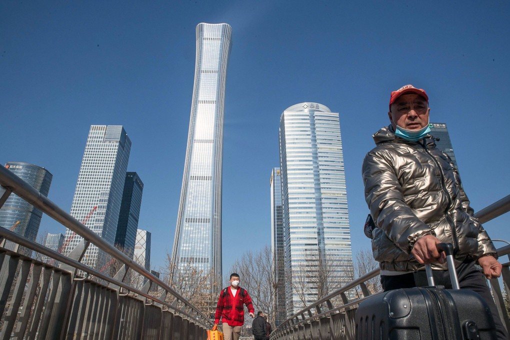 Pedestrians on an overpass in Beijing. Photo: Bloomberg