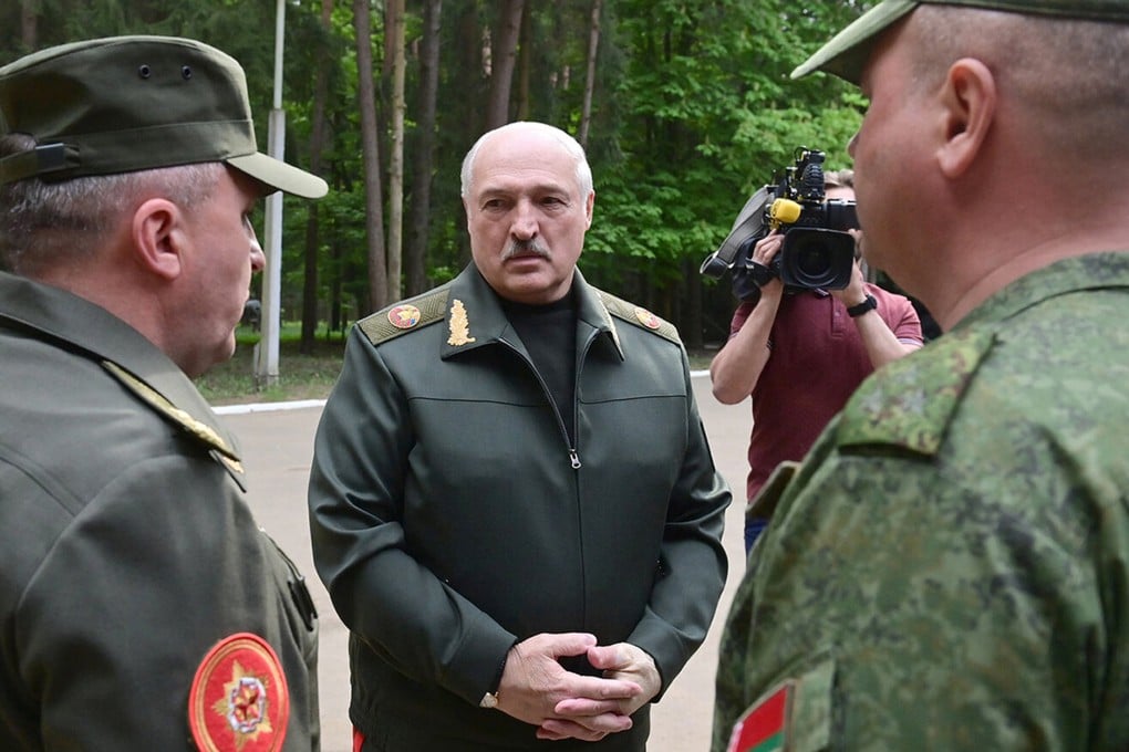Belarusian President Alexander Lukashenko (centre) speaks to officers as he visits the Central Command Post of the Air Force and Air Defence Forces in Belarus on Monday. Photo: Belarus’ Presidential Press Office via AP