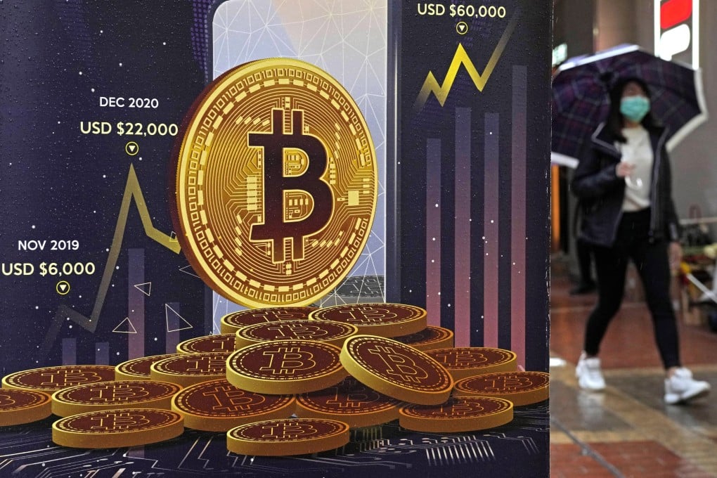 An advertisement for bitcoin is displayed on a street in Hong Kong in February 2022. Cryptocurrencies may have lost their lustre in many parts of the world amid swings in their value, but that has not dampened enthusiasm in Asia and Africa for central bank digital currencies. Photo: AP
