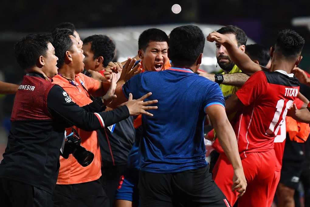 A fight breaks out on the sidelines of the final between Thailand and Indonesia. Photo: AFP