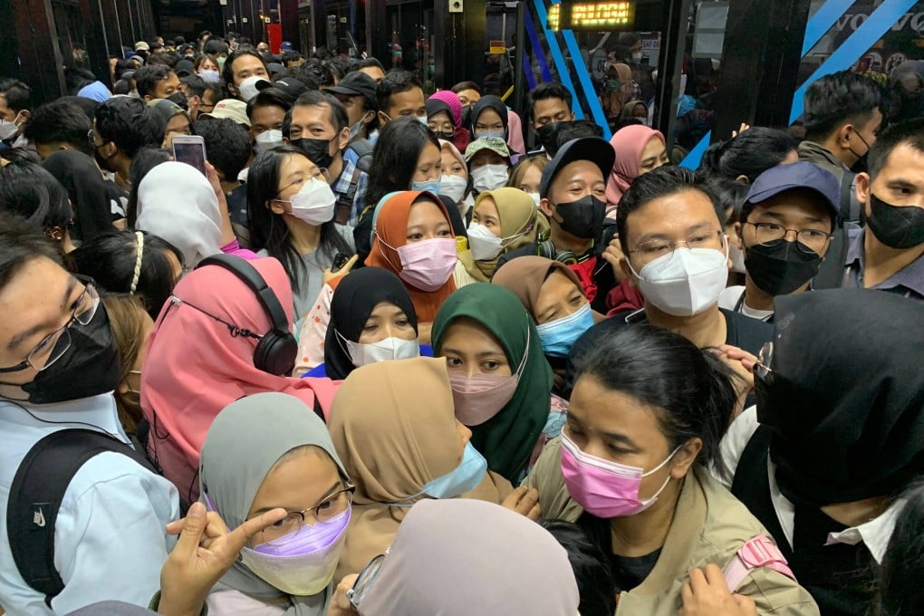 People queue at a bus station in Jakarta last summer. Indonesia is set to lose its title as the world’s fourth-most populous nation by 2045. Photo: AFP
