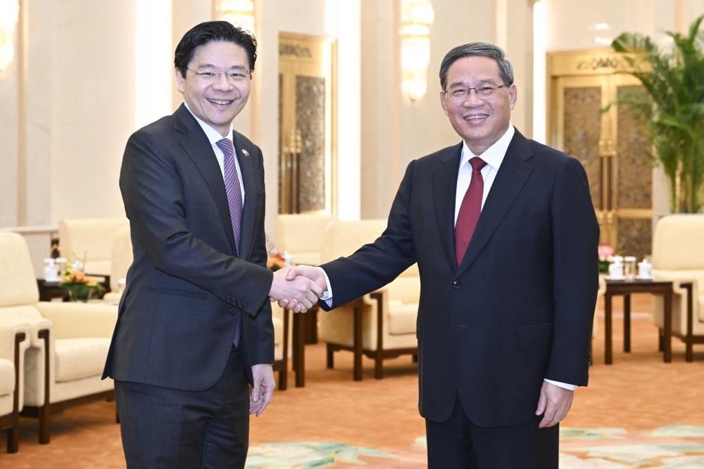 Chinese Premier Li Qiang (right) and Deputy Prime Minister and Minister for Finance of Singapore Lawrence Wong in Beijing, on May 16, 2023. Photo: Xinhua