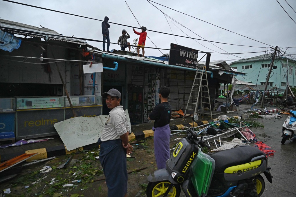 Local residents check the damages after Cyclone Mocha crashed ashore, in Kyauktaw in Myanmars Rakhine state on Sunday. Photo: AFP