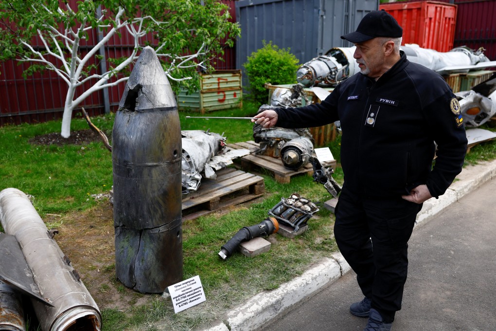 Oleksandr Ruvin, director of the Kyiv Scientific Research Institute of Forensic Expertise, examines a Russian Kinzhal hypersonic missile warhead shot down by a Ukrainian air defence unit in Kyiv on May 12. Photo: Reuters