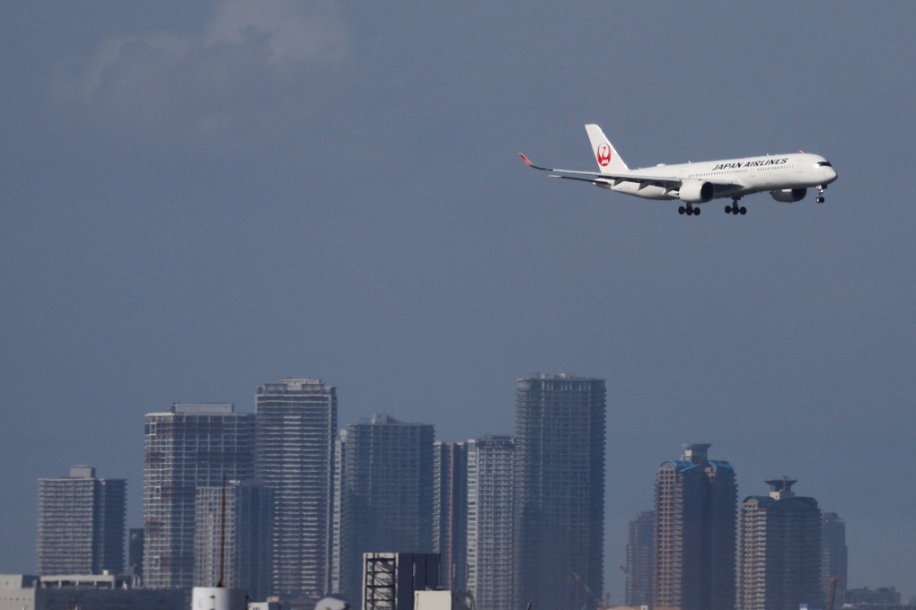 An aircraft approaches Tokyo’s Haneda Airport. Tourists are once more flocking to Japan, but some entry points are struggling to cope with the influx. Photo: Reuters