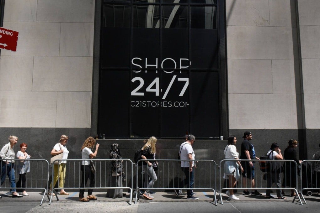 Customers wait to enter the grand reopening of a Century 21 department store in New York, US, on May 16. Photo: Bloomberg