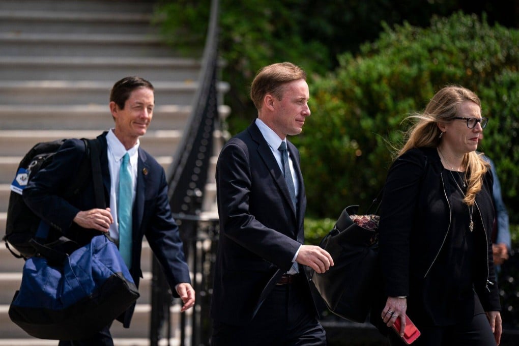 US National Security Adviser Jake Sullivan (centre) walks outside the White House on Wednesday before starting his trip to Japan. Photo: Bloomberg