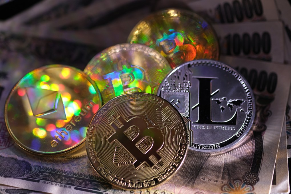 Representations of the digital cryptocurrency, bitcoin, Litecoin and ether are displayed atop Japanese 10,000 yen notes on March 20, 2020. Photo: Getty