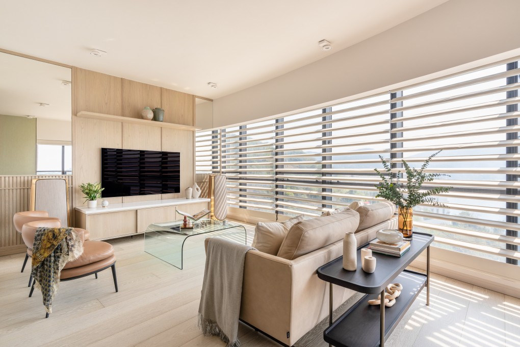 The living room of a Tai Tam home renovated by Jessica Lee Yi-chi. After 30 years in their Tai Tam flat, a couple gave themselves new, light-filled, contemporary interiors complete with smart-home functions. Photo: HHM Studio
