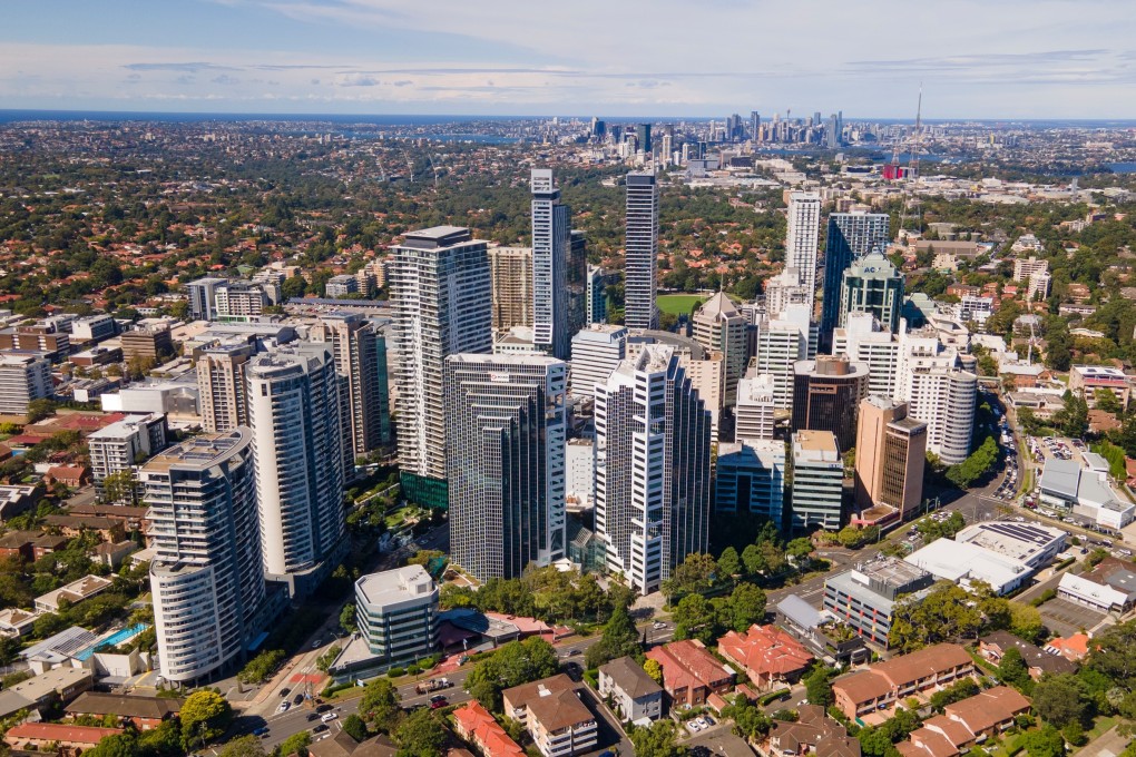 A drone’s eye view of the business district of Chatswood a north shore satellite city of Sydney, visible in the distance. Photo: Shutterstock