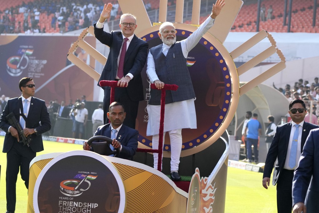 Indian PM Narendra Modi and his Australian counterpart Anthony Albanese wave to the crowd as they arrive at a stadium in in Ahmedabad to watch a cricket test match between India and Australia in March. Photo: AP
