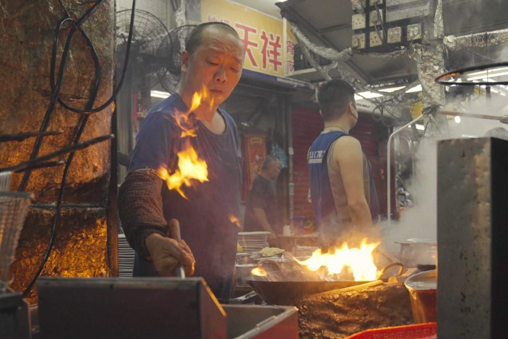 Cooks working in a “dai pai dong” in Hong Kong. From such street food stalls to fine-dining Cantonese restaurants, customers savour the effect of “wok hei”, the “breath of the wok”, in their food. Photo: Llewellyn Cheung