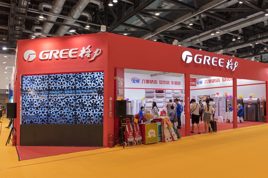 Visitors are seen at the Gree Electric booth during the China Hua Xia Housing and Furnishing Exposition. Photo: Shutterstock Images