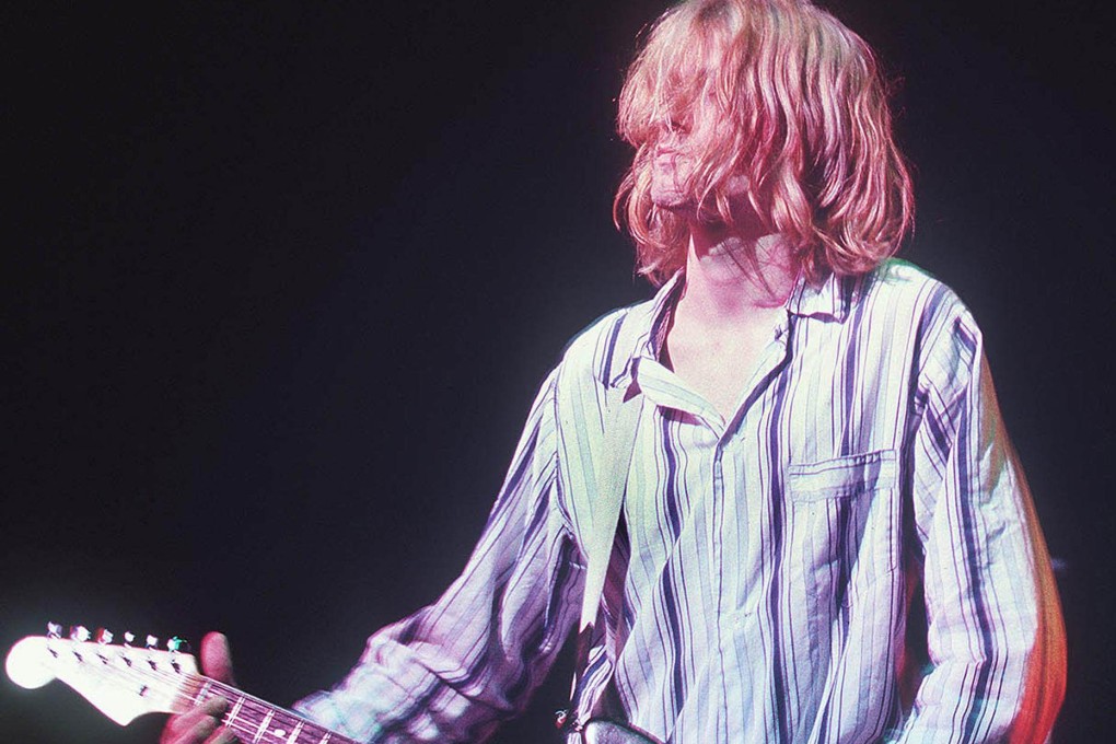 A broken guitar the once belonged to Kurt Cobain, lead singer for the US grunge rockers Nirvana, has sold for more than half a million dollars. Photo: AFP
