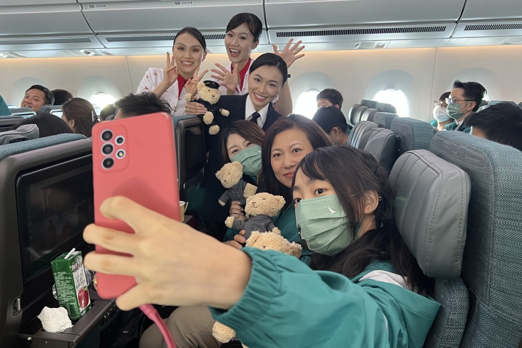 Jenny Lau poses for a photograph aboard the free Cathay flight on Sunday. Photo: Willa Wu