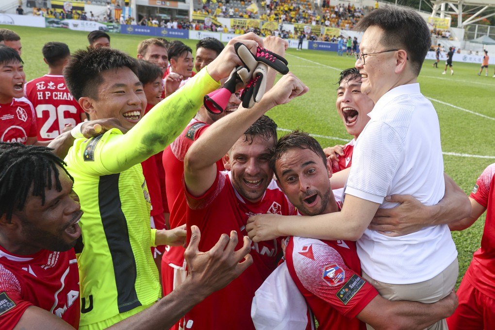 Kwoon Chung Southern players celebrate with chairman Chan Man-chun (right) after winning the Sapling Cup. Photo: Yik Yeung-man