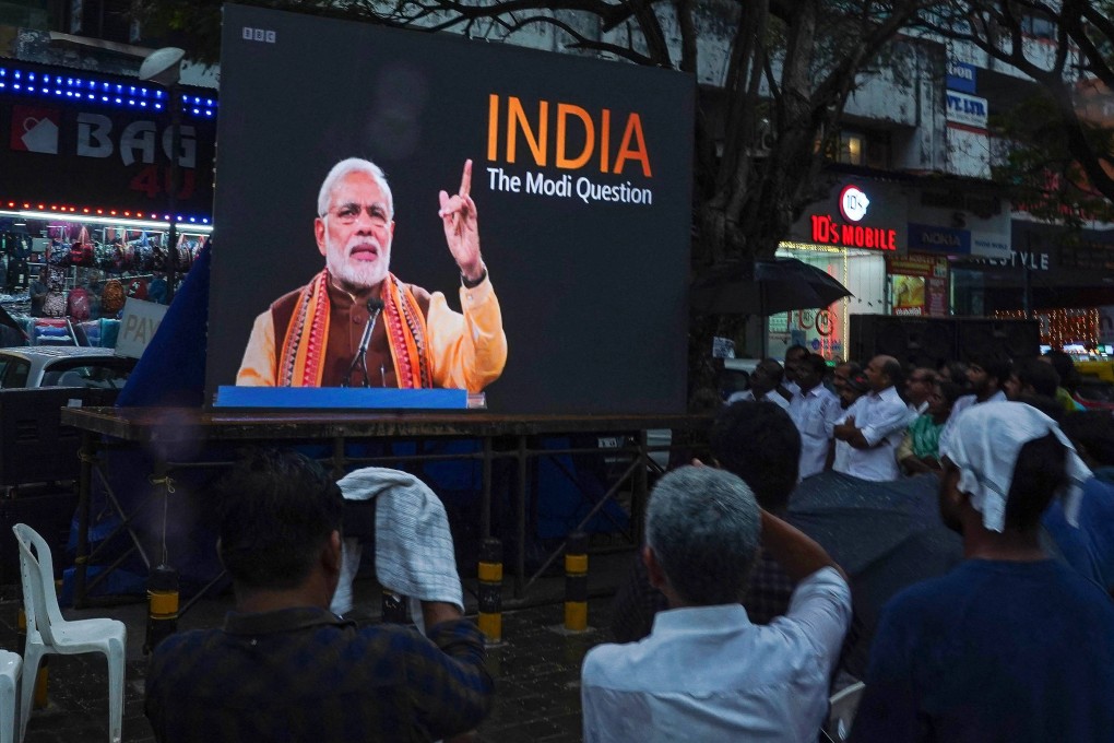 People watch the BBC documentary, India: The Modi Question,, on a screen in Kochi. Photo: AFP