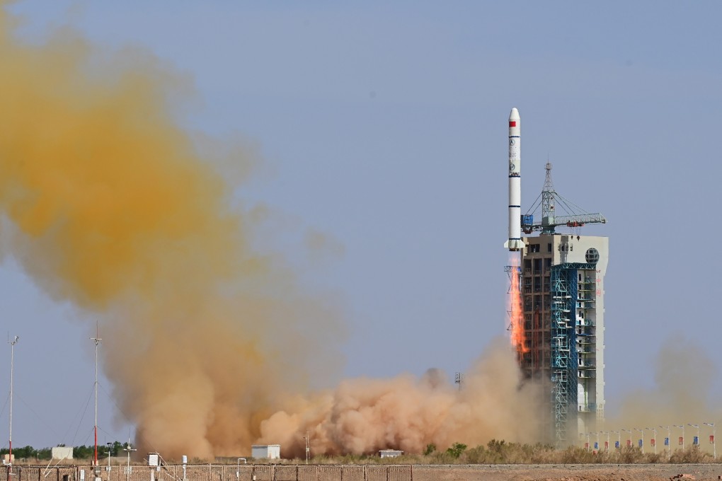 A Long March 2C rocket blasts off from the Jiuquan launch site in the Gobi Desert on Sunday, carrying the Macau Science 1 satellites. Photo: EPA-EFE/Xinhua