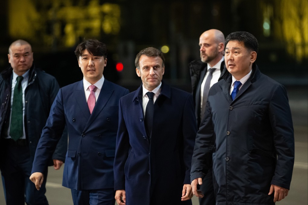 Mongolia’s President Ukhnaagiin Khurelsukh, left, and French President Emmanuel Macron, centre, during a visit to Genghis Khan Museum in Ulaanbaatar, Mongolia on Sunday. Photo:  EPA-EFE