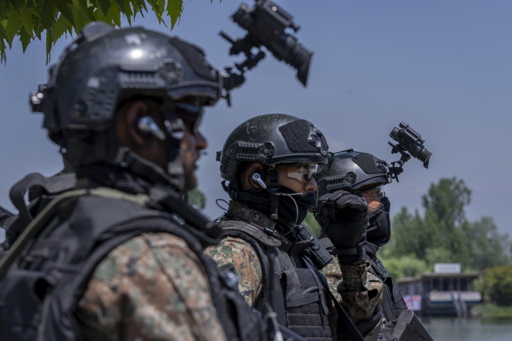 Indian paramilitary soldiers keep guard by the Dal Lake ahead of a G20 tourism working group meeting in Srinagar, Indian controlled Kashmir. Photo: AP