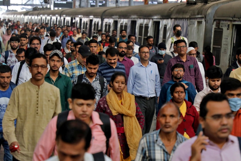 Commuters walk on a platform after disembarking from a train in Mumbai, India. The nation’s last census was due in 2021. It is still unclear when it might happen. Photo: Reuters