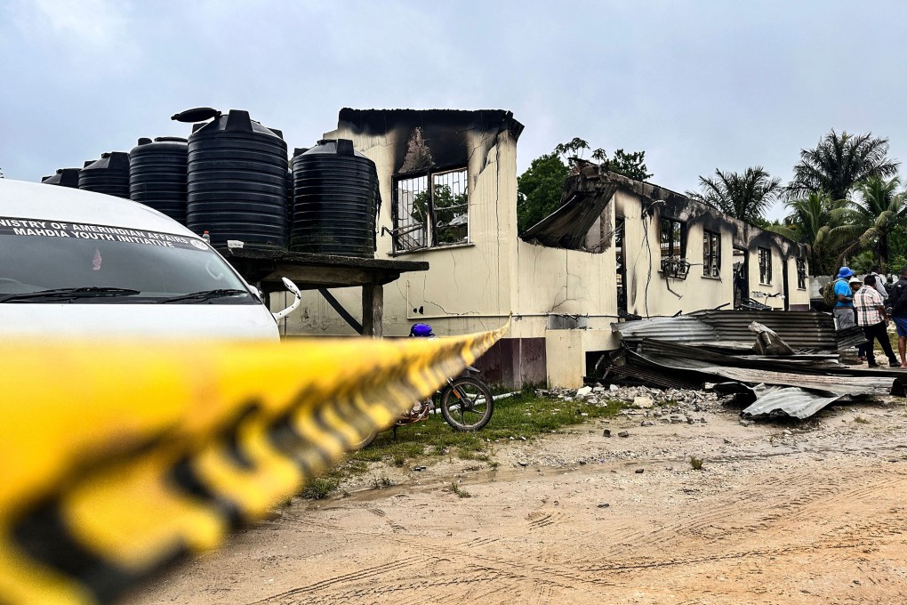 A view of the school dormitory that caught fire and left at least 19 people dead in Mahdia, Guyana on Monday. Photo: TNS