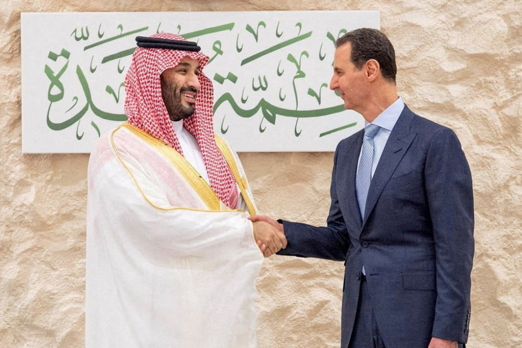 Saudi Arabia’s Crown Prince Mohammed bin Salman, left, shakes hands with Syria’s President Bashar al-Assad on May 19, 2023. Photo: Bandar Algaloud/Courtesy of Saudi Royal Court/Handout