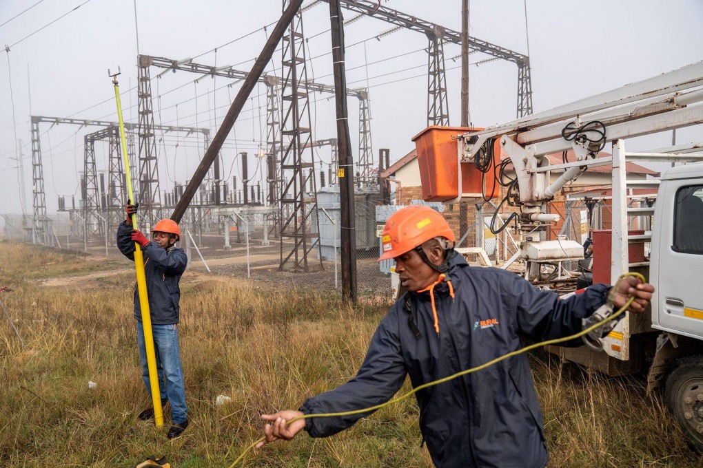 Workers conduct maintenance on the power grid in Villiers, South Africa, on May 10. The European Union’s Global Gateway initiative envisions infrastructure initiatives that can improve connectivity, stimulate trade and raise living standards throughout Africa. Photo: AFP