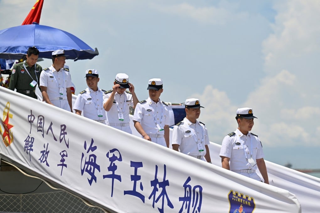 Navy personnel from the Chinese People’s Liberation Army disembark from China’s guided missile frigate during a defence exhibition held at Singapore’s Changi Naval Base earlier this month. Photo: Reuters