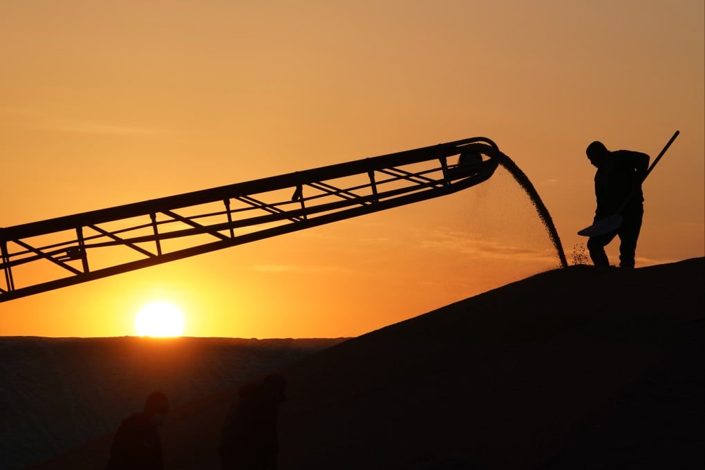 An employee works on a pile of corn at a drying yard in Beian, northeast Heilongjiang province, on October 20, 2022. China is a top importer of the most widely traded crops globally: soybeans, vegetable oil, corn and sugar. Photo: Xinhua