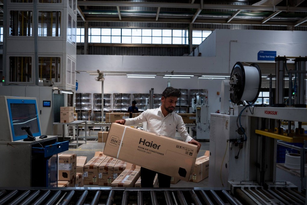 A worker at the manufacturing line of Haier’s air conditioner factory in Greater Noida, India. The Chinese company’s overseas expansion has led to huge growth in revenue. Photo: Bloomberg