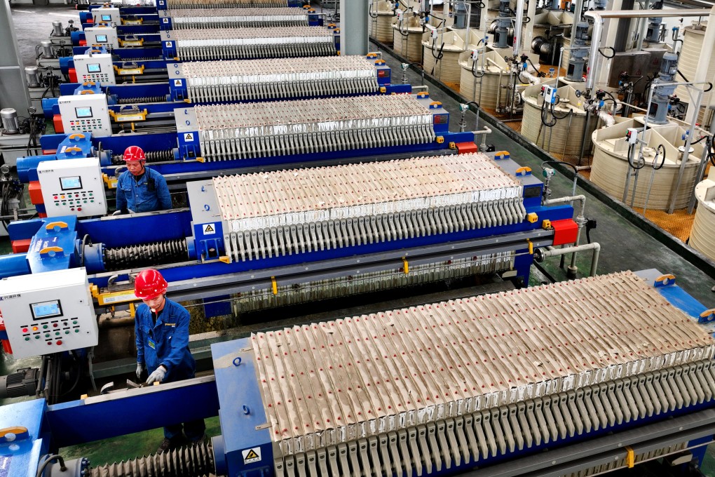 Employees recycle batteries from electric vehicles at Paersen Environmental Technology’s workshop in Weinan, in China’s Shaanxi province. Photo: VCG via Getty Images