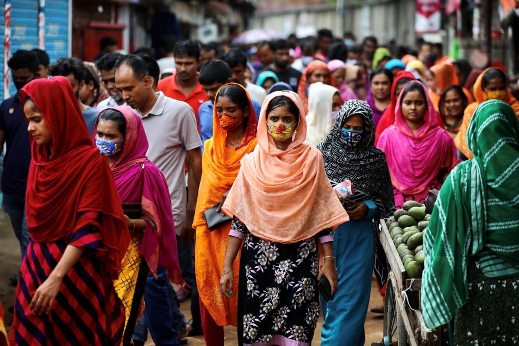 Garment workers during a lunch break in Dhaka. Bangladesh remains dangerously dependent on its ready-made garment industry, which accounts for some 82 per cent of export revenues. Photo: Reuters