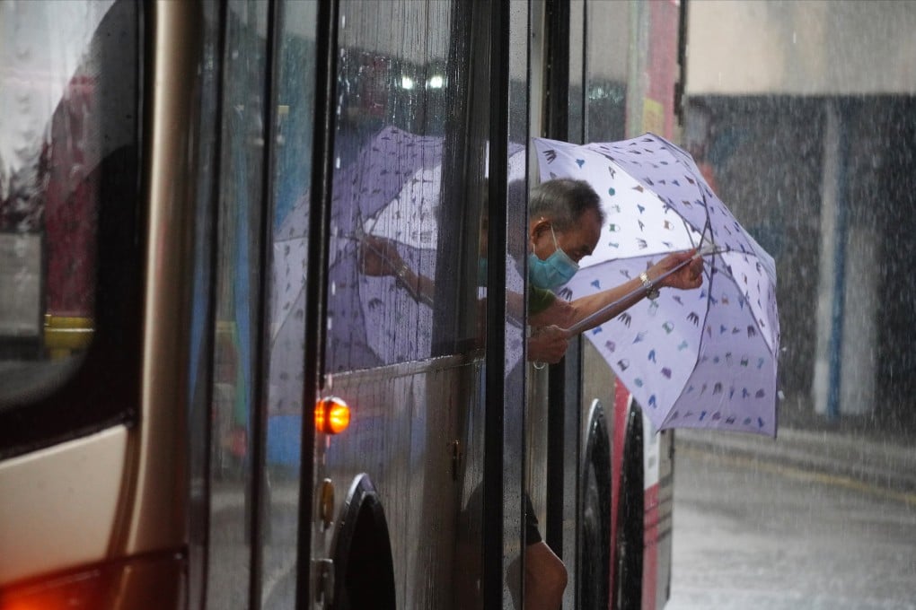 An elderly man steps out of a bus into the rain in Tsim Sha Tsui in August 2020. The purpose of the subsidised public transport fare for the elderly must be clear. Photo: Sam Tsang