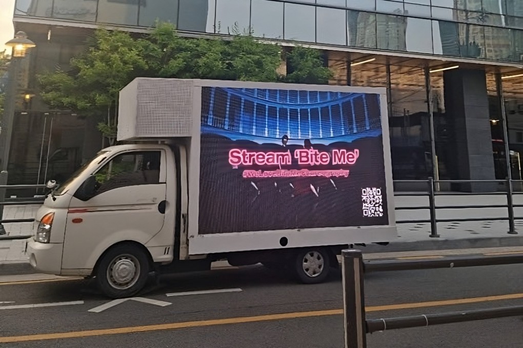 Some of the trucks sent by international fans in support of the backup dancers in Enhypen’s new song “Bite Me” featured messages written in English. Photo: Twitter/@heeeism