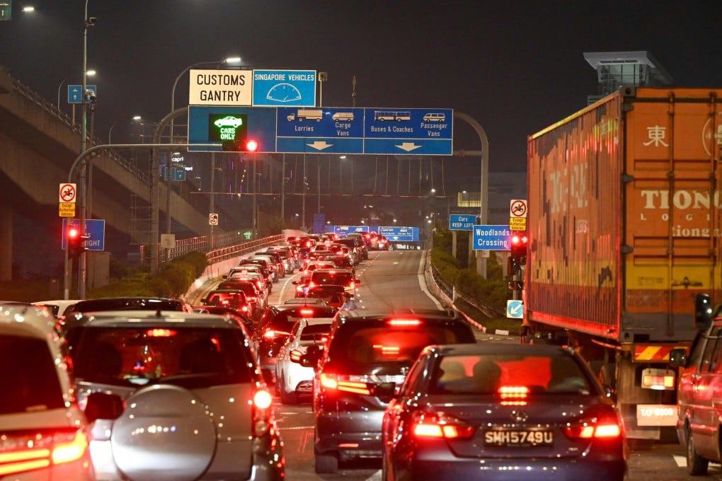Vehicles form a long queue to enter the Woodlands Checkpoint in Singapore before crossing the causeway to Malaysia’s southern Johor state. Singapore and Malaysia share one of the busiest overland borders in the world. Photo: AFP
