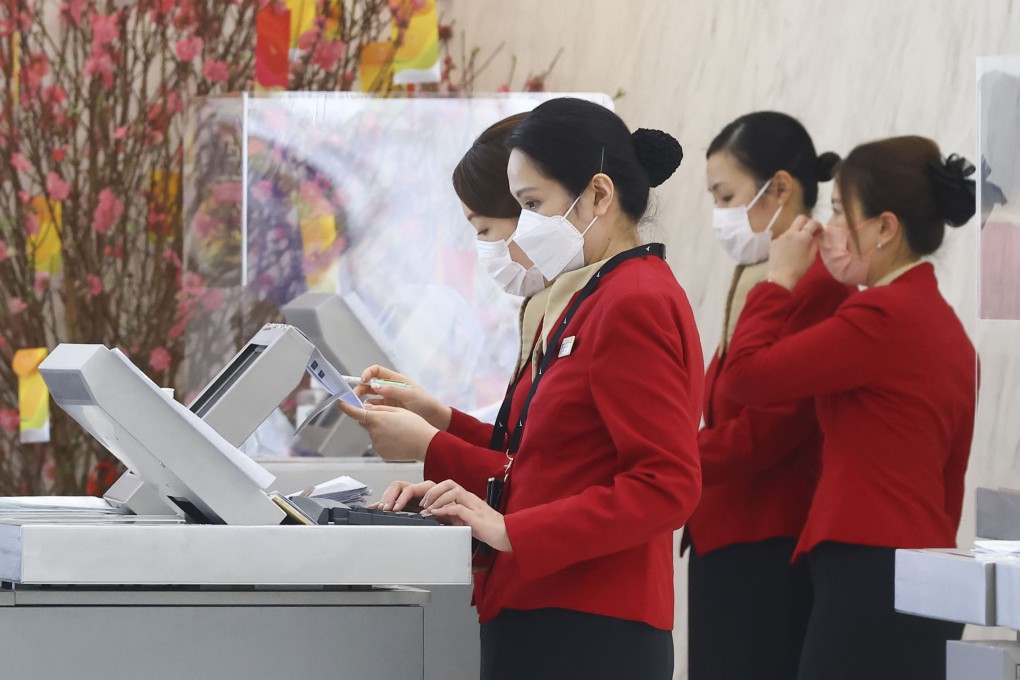 Cathay Pacific staff on duty at Hong Kong airport on January 19, 2023. A recent discrimination scandal saw the airline fire three staff members over insulting comments they made about passengers. Photo: Dickson Lee