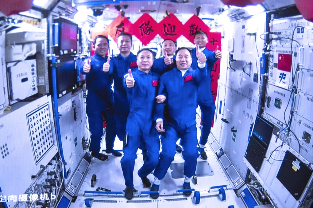 The crews of Shenzhou-15 and Shenzhou-16 take a group picture inside the core module of China’s space station on Tuesday. Photo: Xinhua via AP